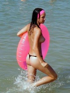 Very hot long-haired chick swimming full clothed