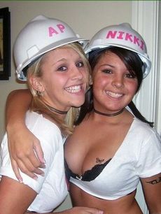 Two lovely girls posing on cam in helmets.