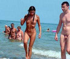 Some middle-aged couples sunbathing on nudist